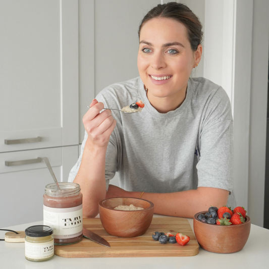 woman eating porridge with berries and sea moss