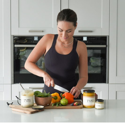 woman chopping up vegetables to use with irish sea moss gel